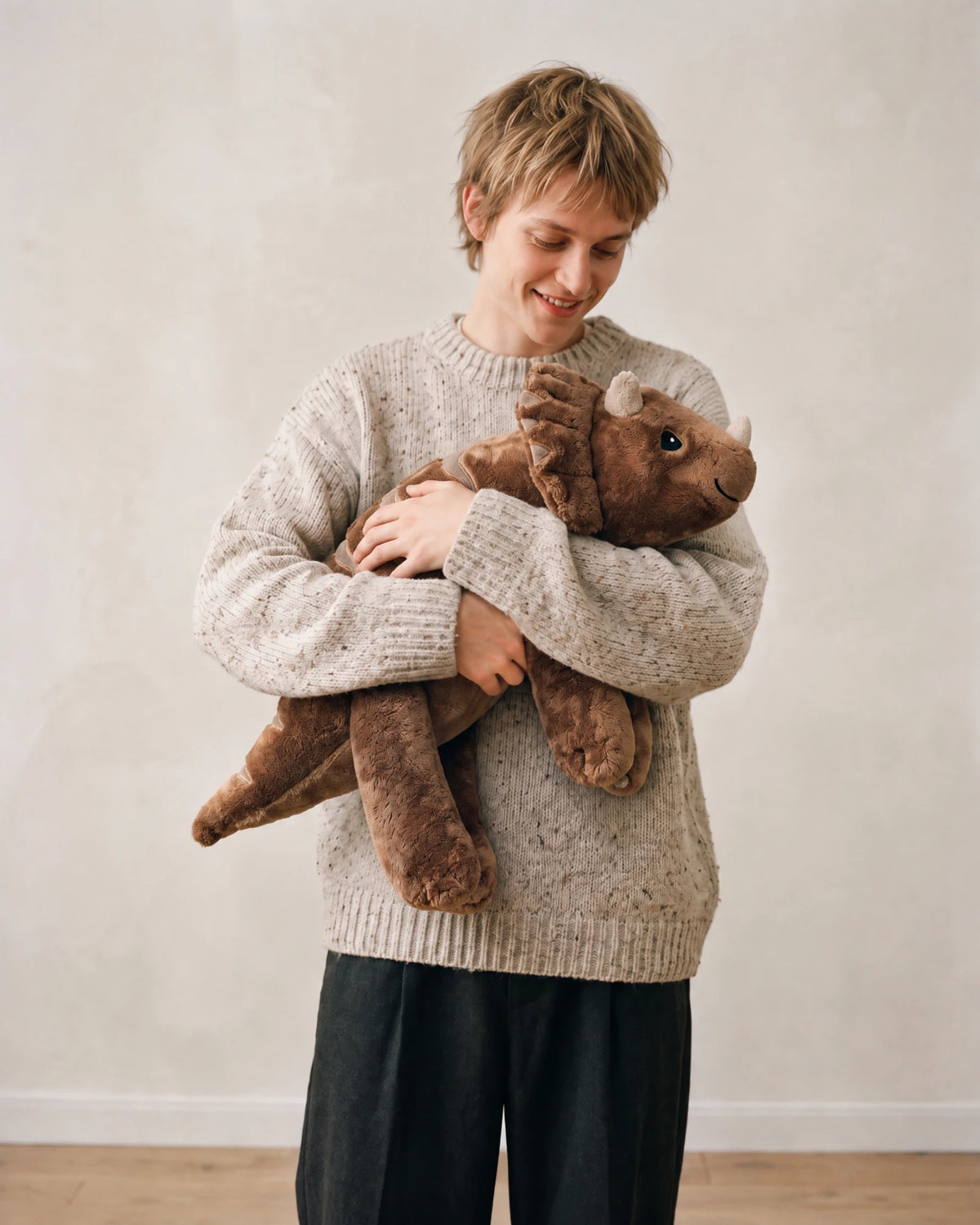 Young man hugging the weighted Dinosaur in Coffee, 2.3 kg #Colour_Coffee