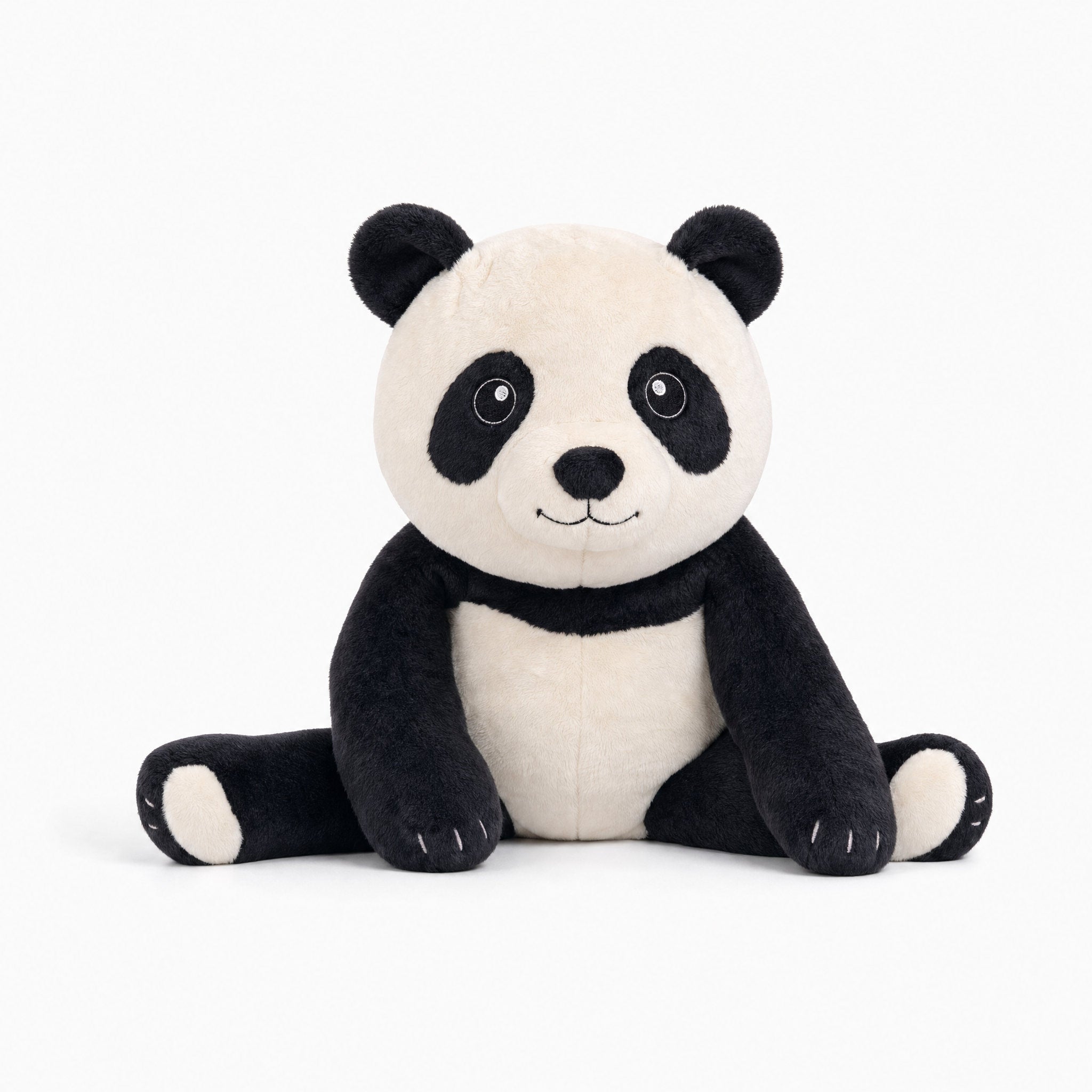 Brease Weighted Panda 5 lb calming plush sitting and looking at camera