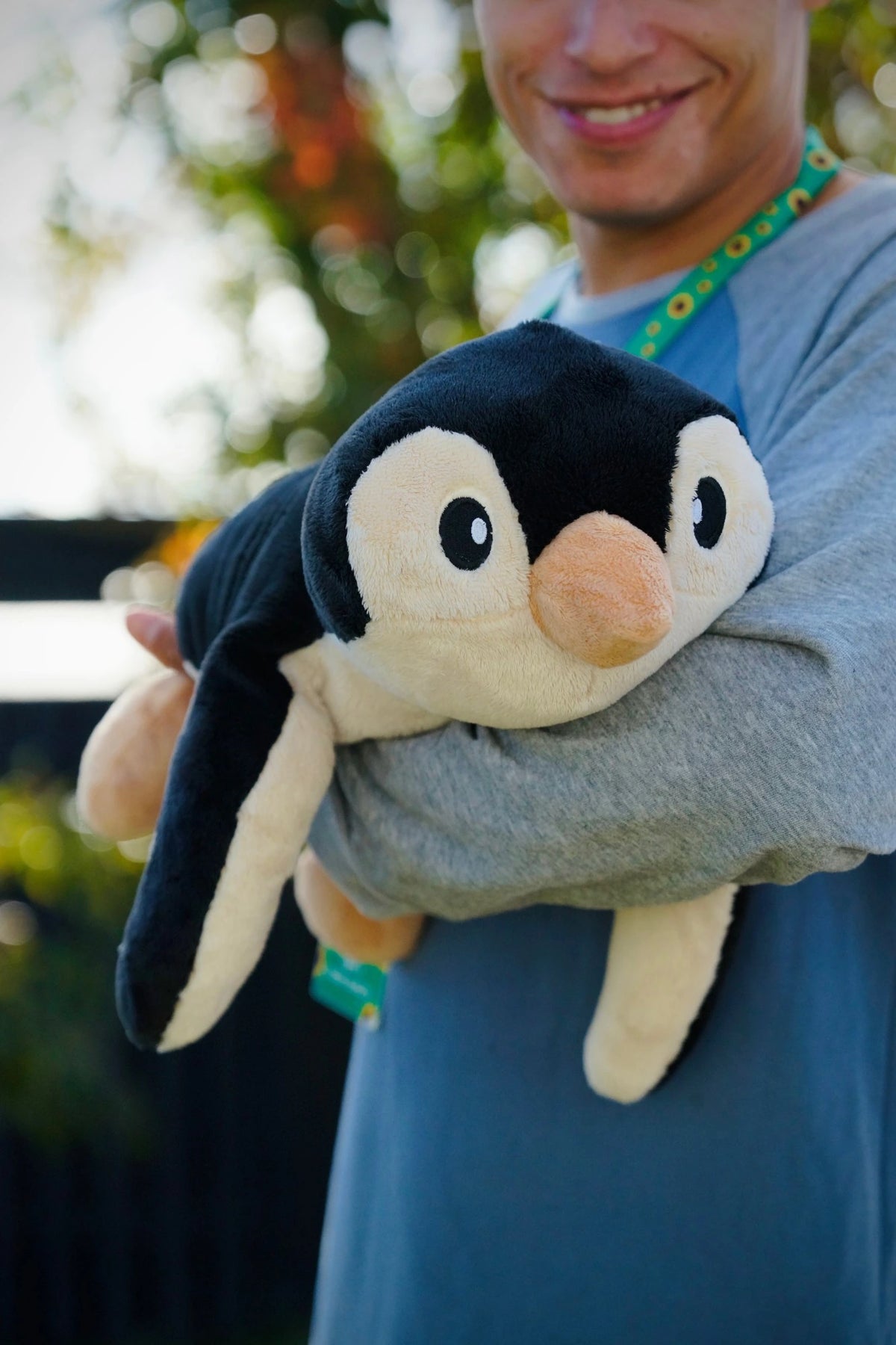The 2.3 kg penguin held in one arm