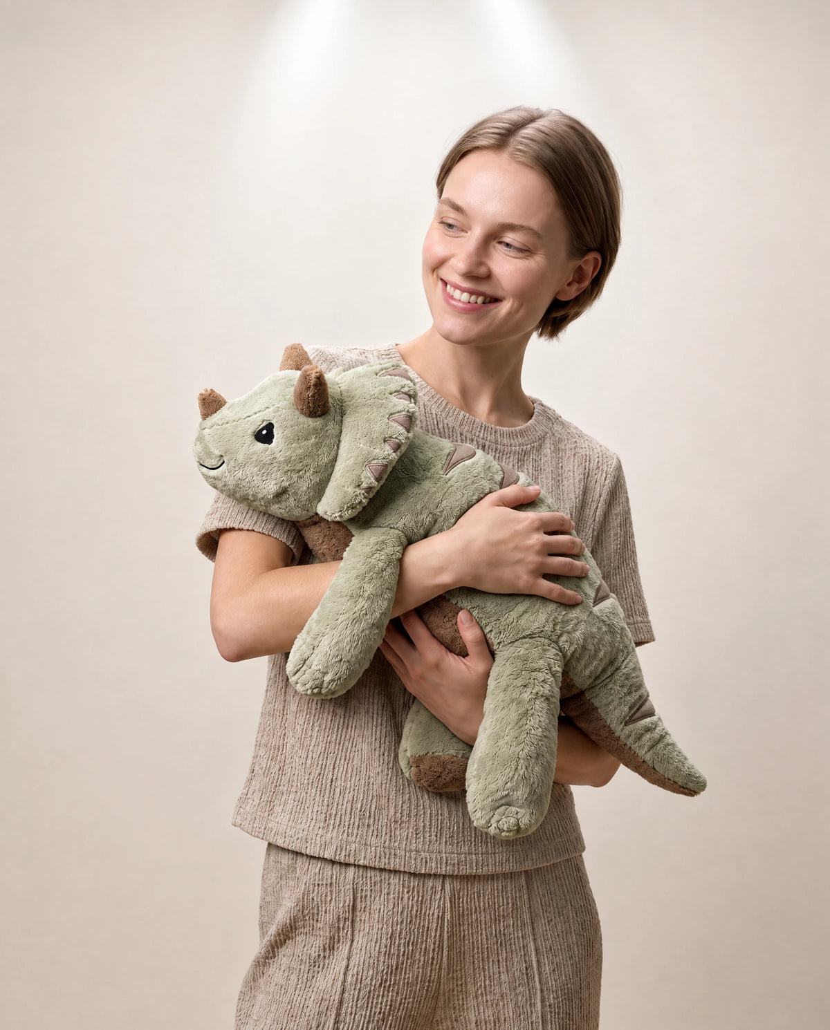 Child hugging the weighted Axolotl in Blue Flame, 2.3 kg