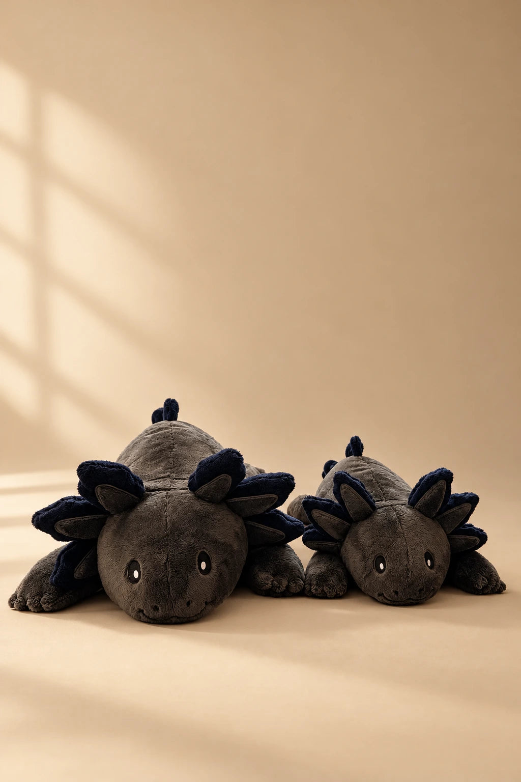 Brease XL 4.5 kg and classic 2.3 kg Blue Flame axolotl in a studio